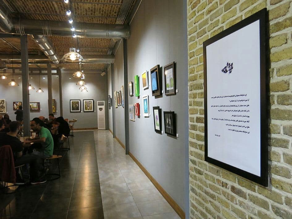 picture of a painting exhibition inside a gallery