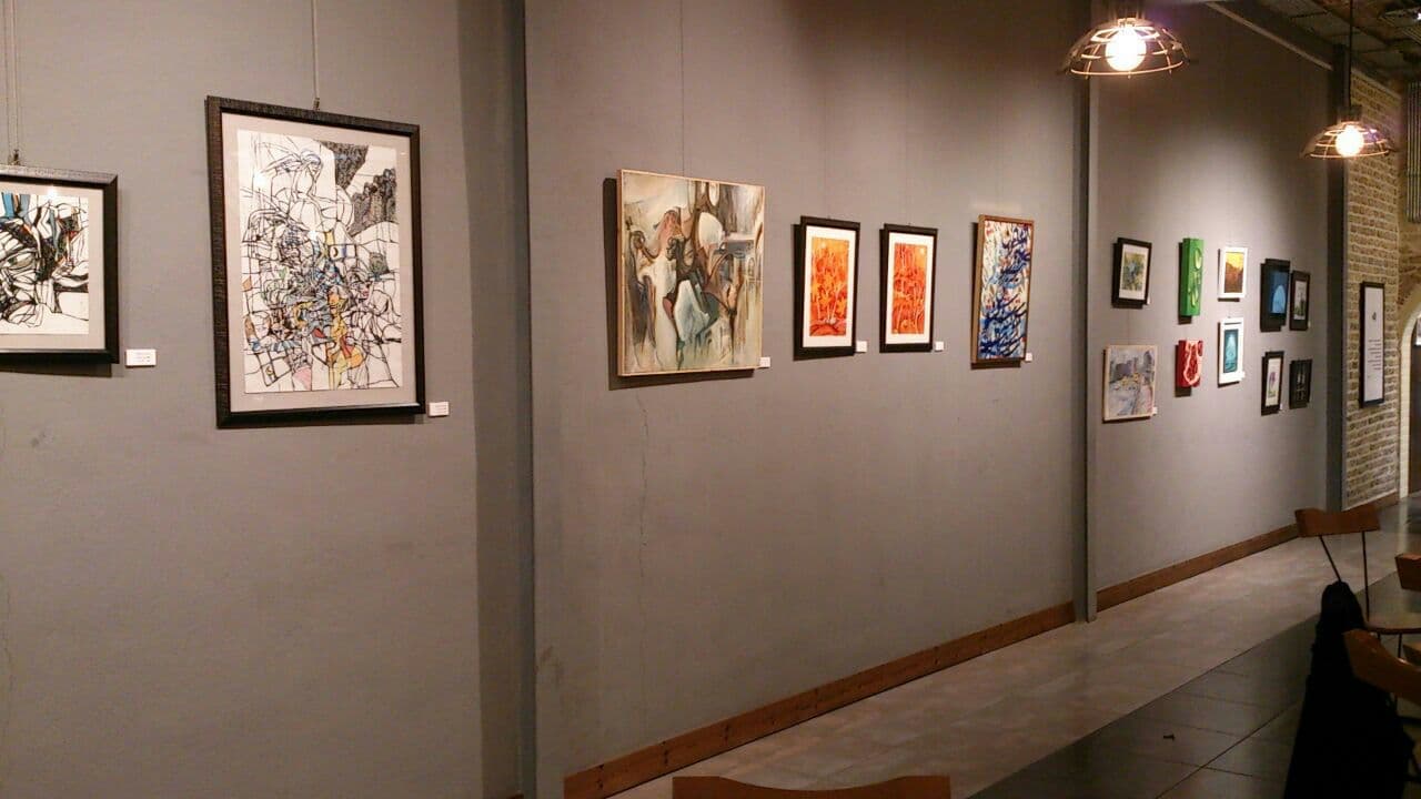 picture of a painting exhibition inside a gallery